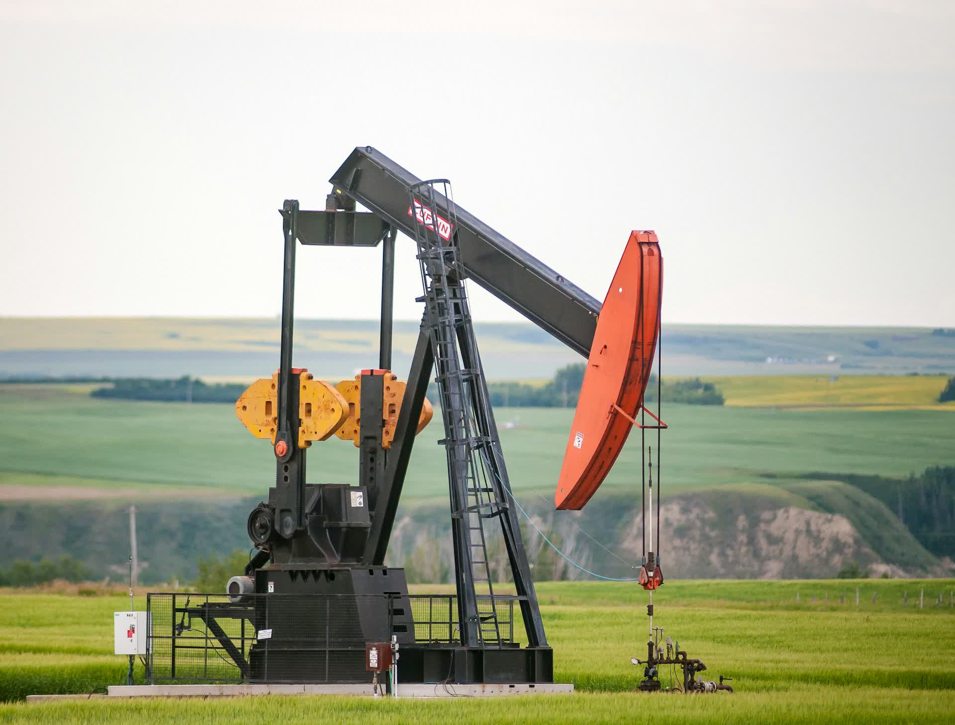 An oil pumpjack on farmland, representing fractional oil and gas mineral royalty interests