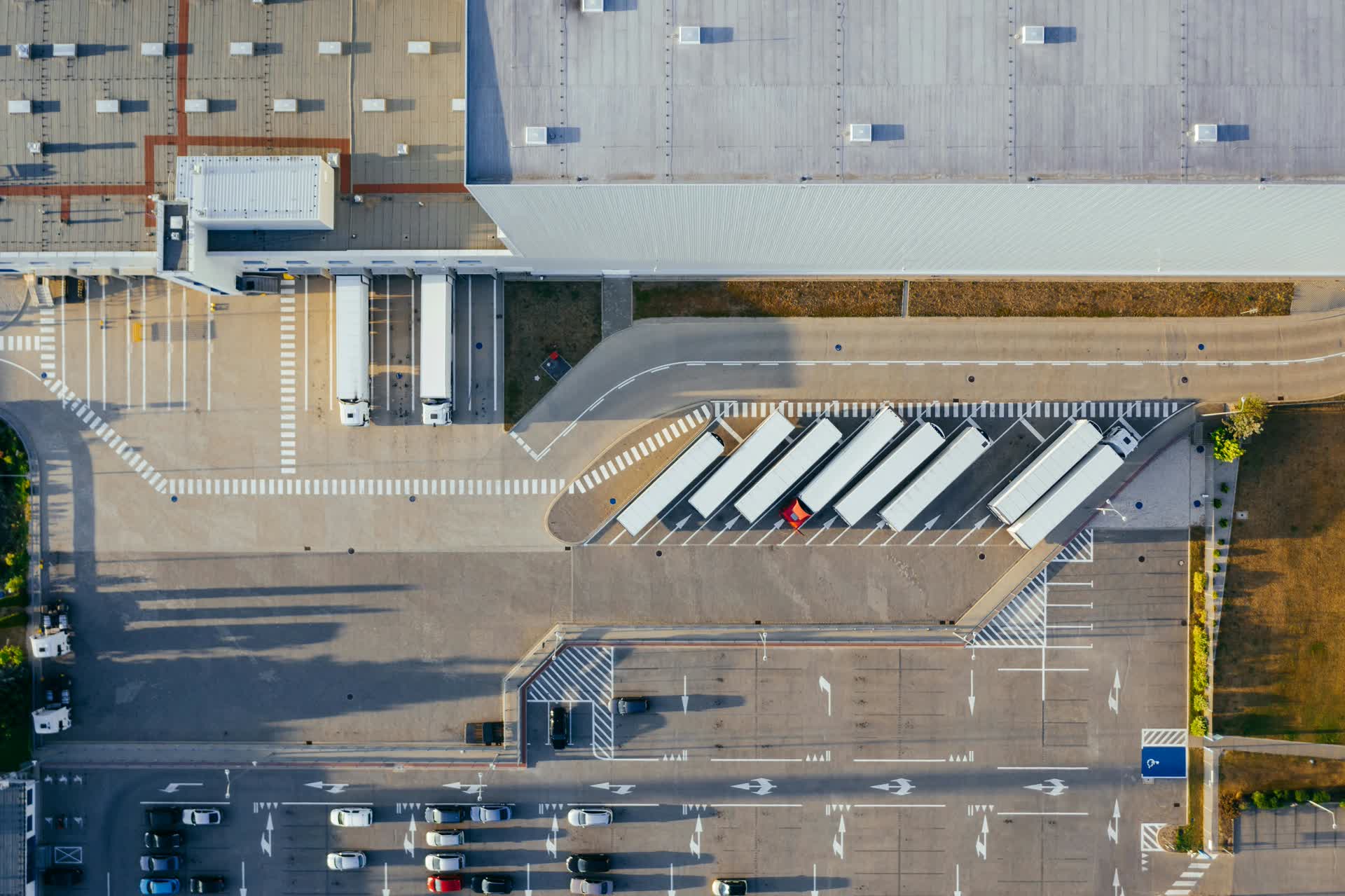 Aerial view of a flex industrial and distribution warehouse complex, the kind of institutional real estate held through Delaware Statutory Trusts